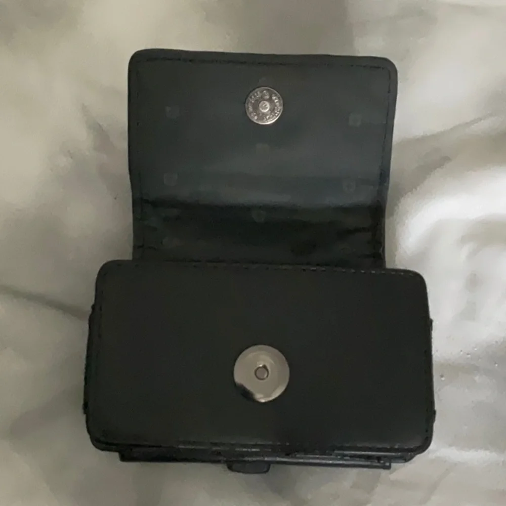 Swiss mobility case. Fits onto belt, and has a loop for a lanyard or strap.